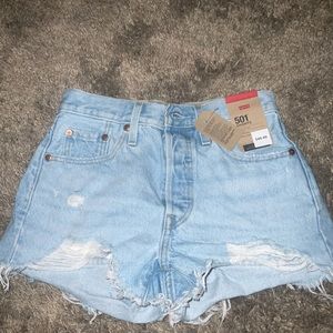 Levi’s 501 “A high rise fitted through the hip”